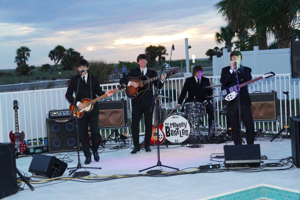 The Mersey Beatles performing seaside for the Ocean club hotel grand opening event