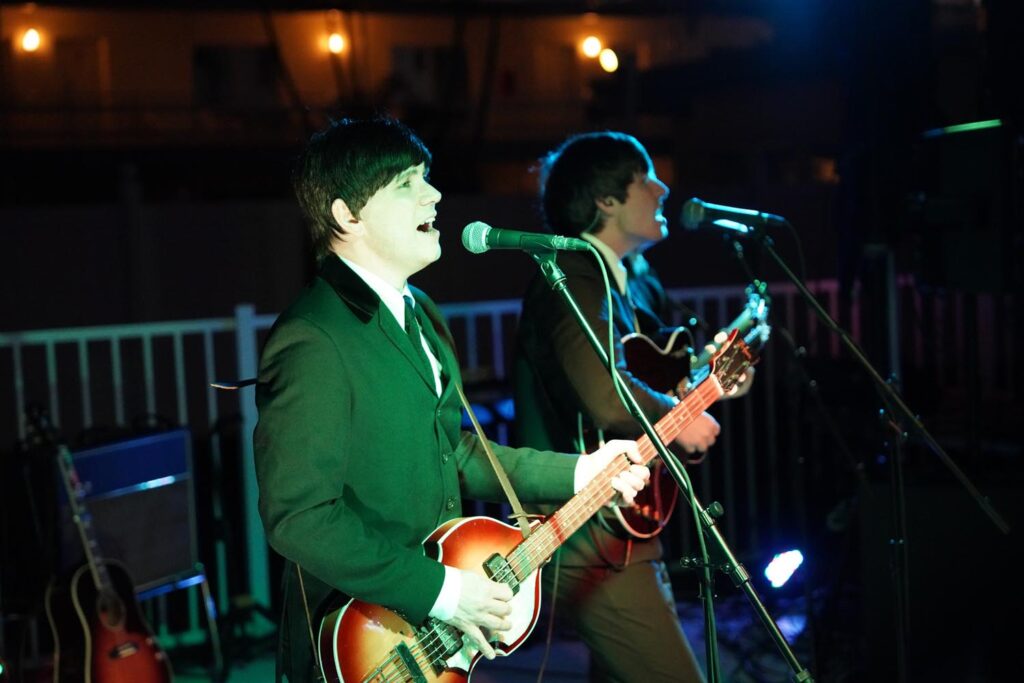 The Mersey Beatles performing seaside for the Ocean club hotel grand opening event