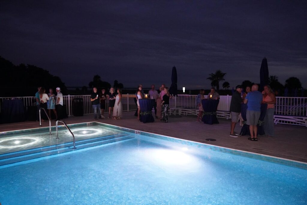 Guests gathered around the pool deck of the Ocean Club Hotel.